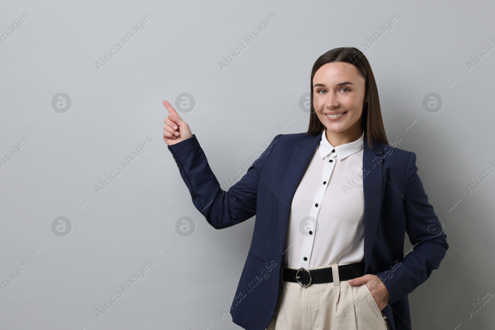 Photo of Portrait of businesswoman on light grey background, space for text