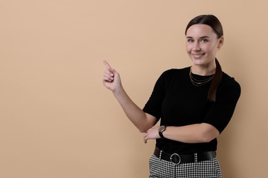 Photo of Portrait of businesswoman on beige background, space for text