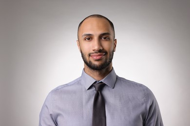 Portrait of businessman on light gray background