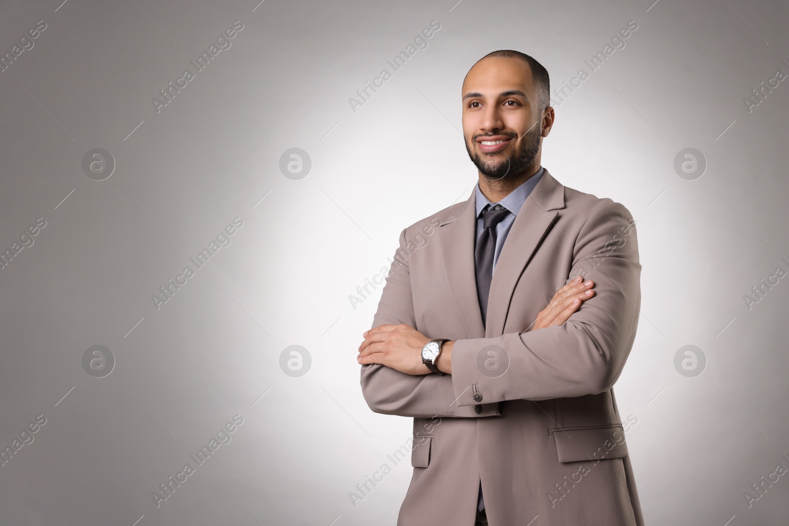 Photo of Portrait of businessman on light gray background, space for text