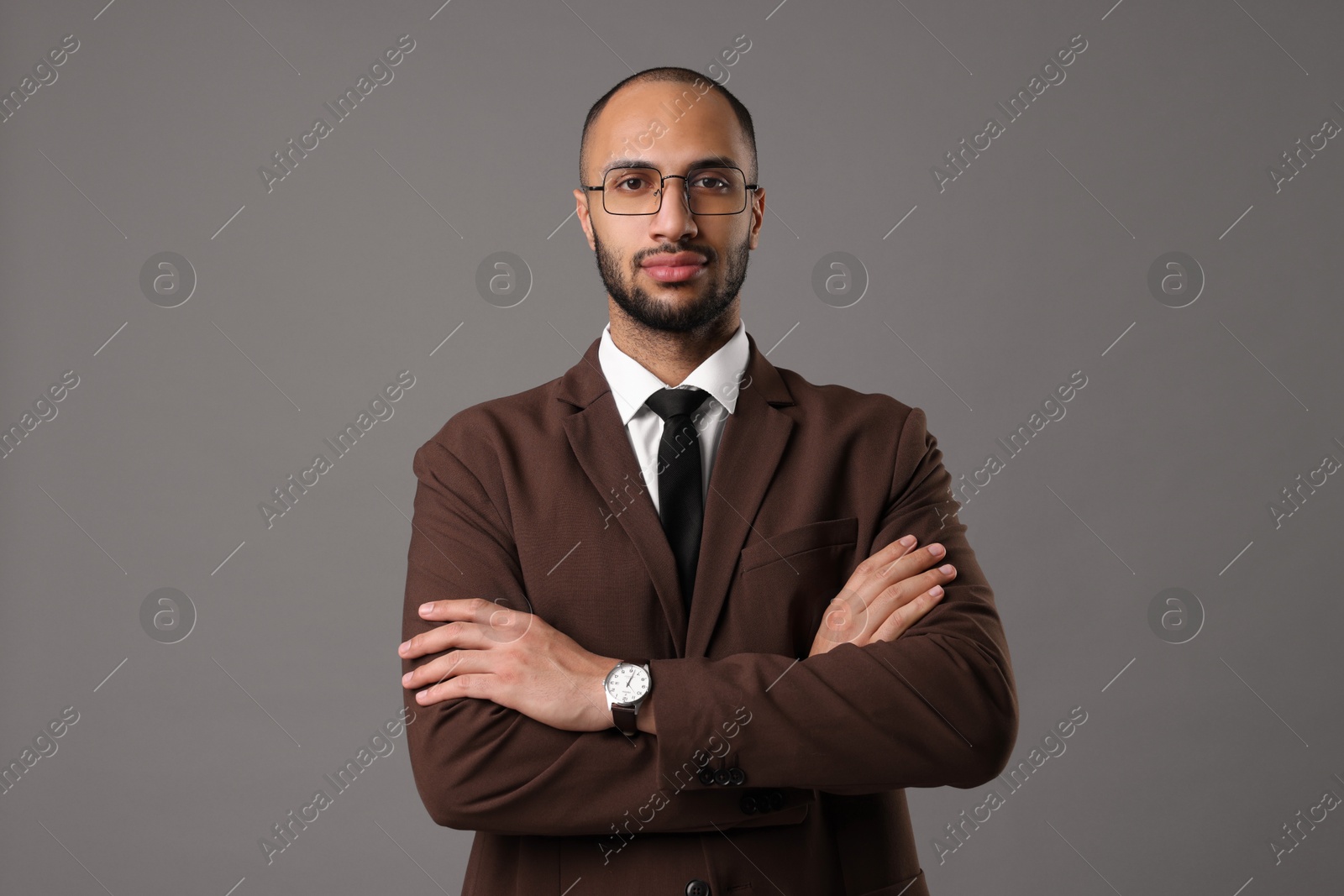 Photo of Portrait of businessman in glasses on gray background