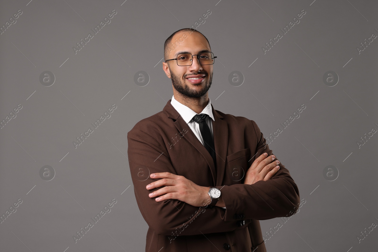 Photo of Portrait of businessman in glasses on gray background