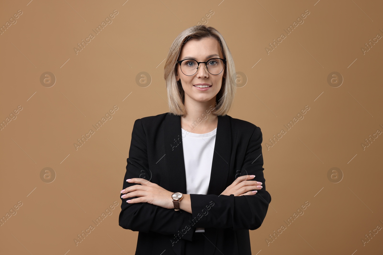 Photo of Portrait of businesswoman in glasses on beige background