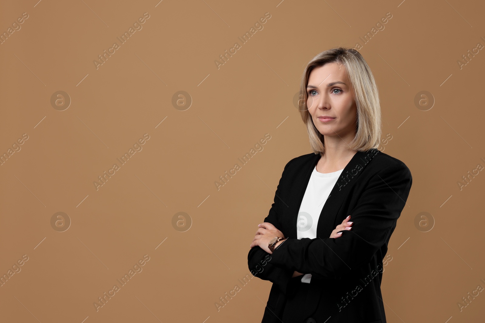 Photo of Portrait of businesswoman on beige background, space for text