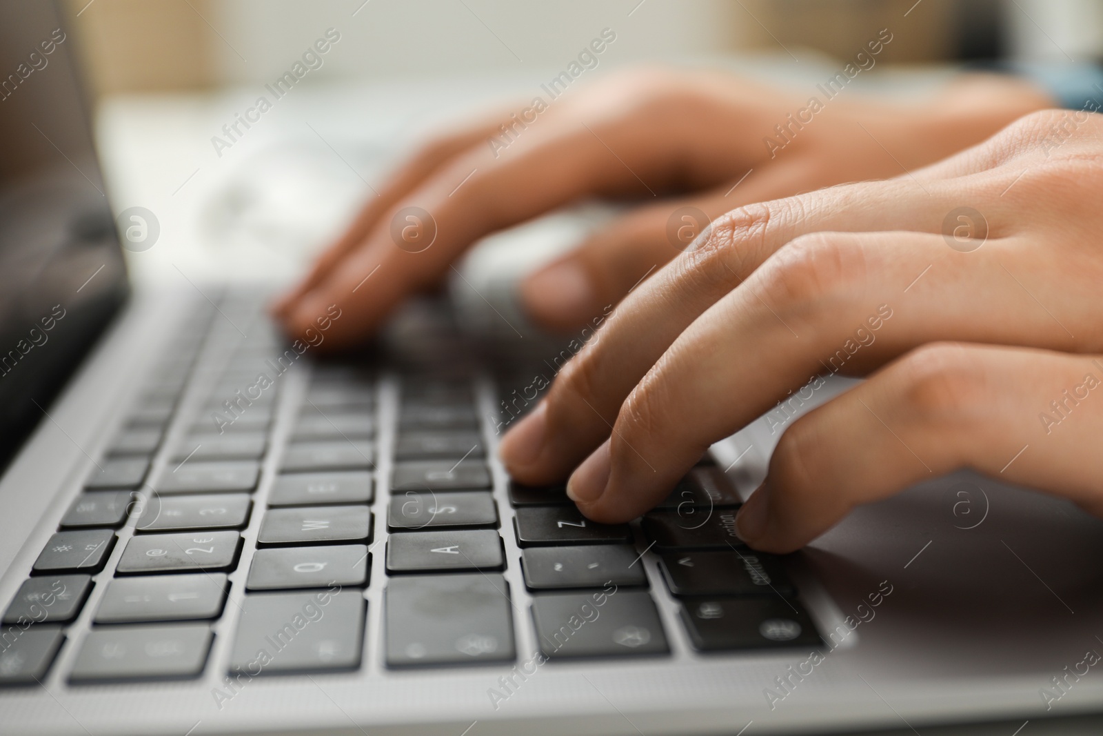 Photo of Businesswoman using laptop indoors, closeup. Modern technology