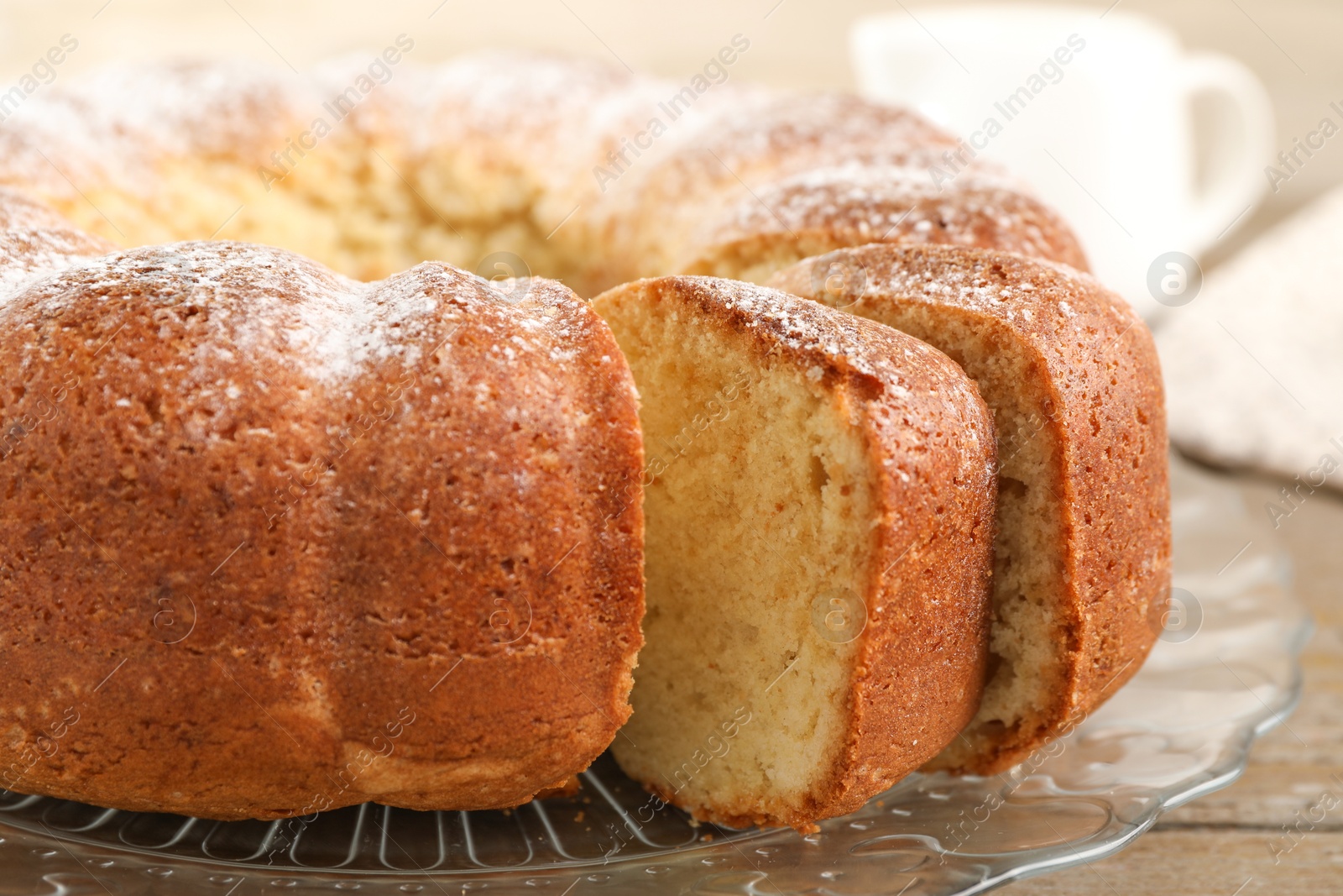 Photo of Freshly baked sponge cake on table, closeup