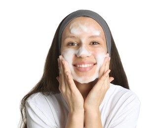 Photo of Teenage girl washing her face with cleanser on white background. Cosmetic product