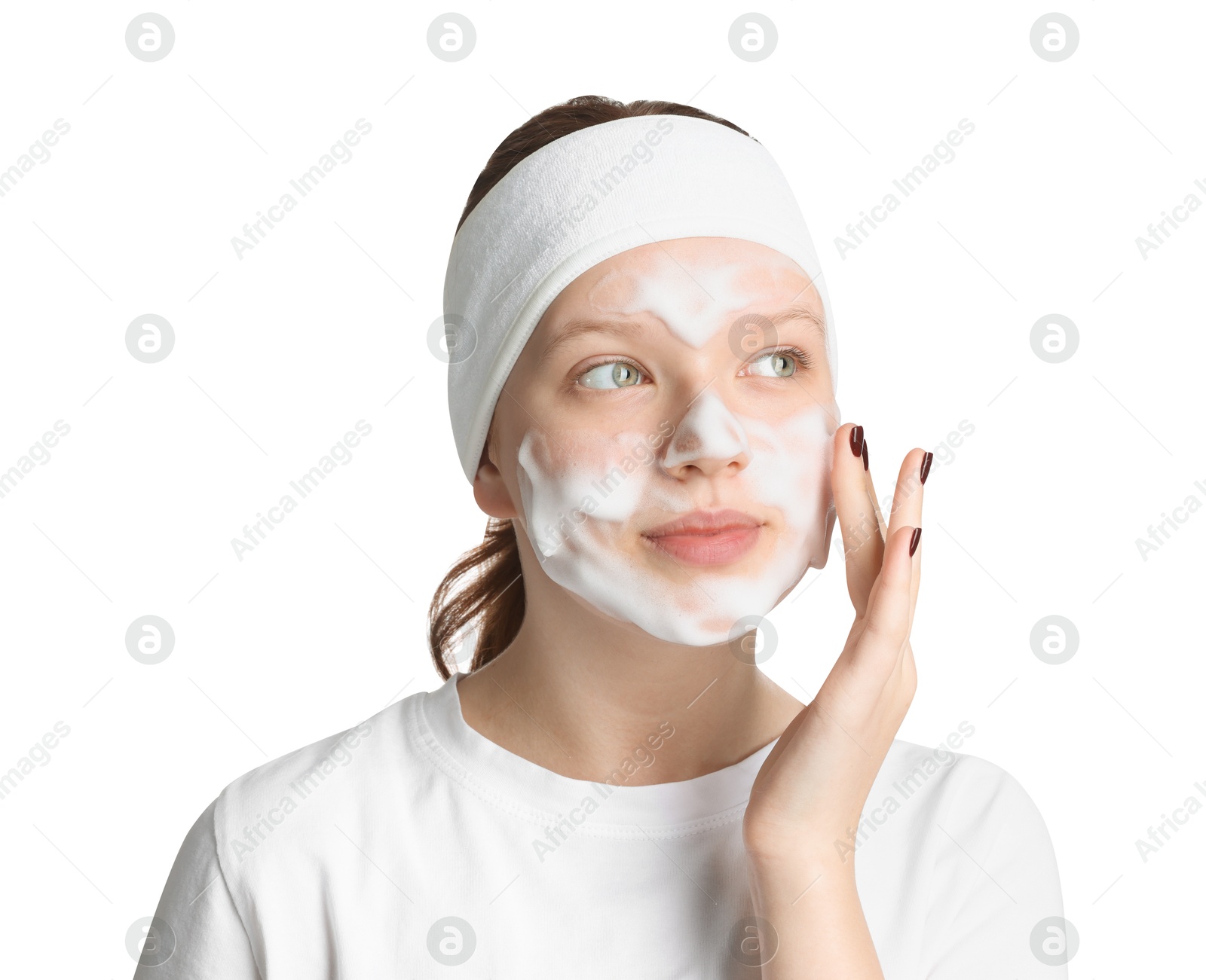 Photo of Teenage girl washing her face with cleanser on white background. Cosmetic product