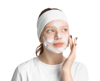 Photo of Teenage girl washing her face with cleanser on white background. Cosmetic product