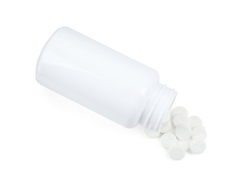 Photo of Medical bottle with antibiotic pills isolated on white, top view