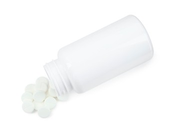 Photo of Medical bottle with antibiotic pills isolated on white, top view