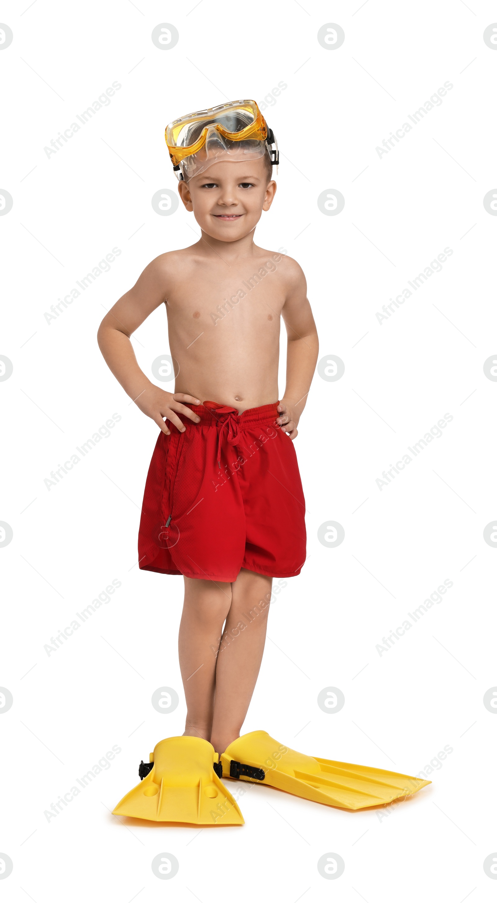 Photo of Cute little boy in beachwear with mask and fins on white background