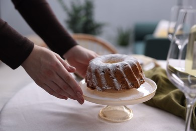 Photo of Woman setting table for dinner at home, closeup