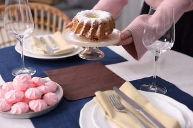 Photo of Woman setting table for dinner at home, closeup