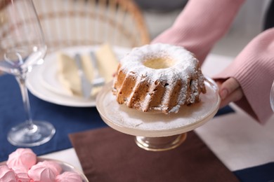 Photo of Woman setting table for dinner at home, closeup