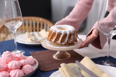 Photo of Woman setting table for dinner at home, closeup