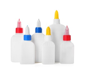 Photo of Many bottles of glue isolated on white