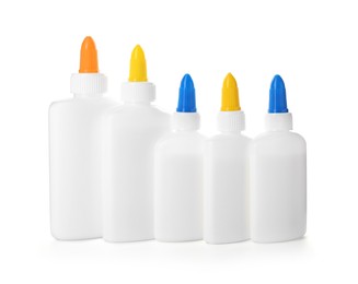 Photo of Many bottles of glue isolated on white