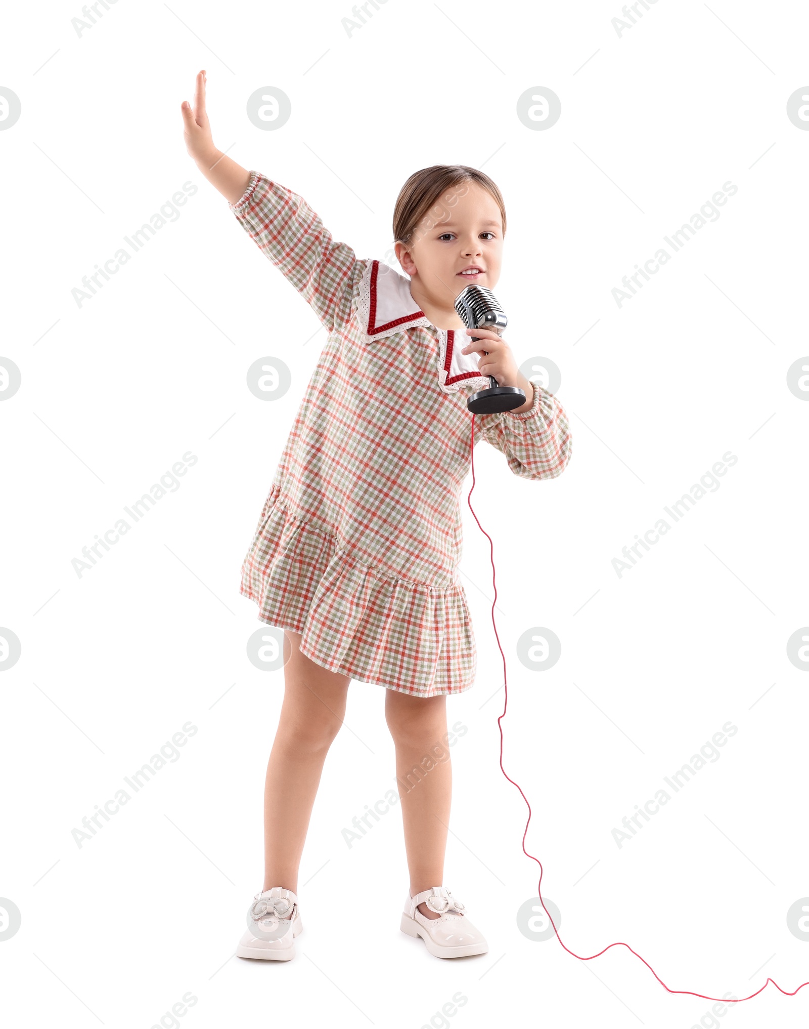 Photo of Cute girl with microphone singing on white background