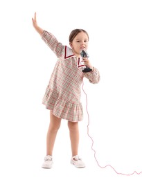 Photo of Cute girl with microphone singing on white background