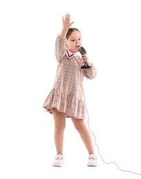 Photo of Cute girl with microphone singing on white background