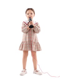 Cute girl with microphone singing on white background