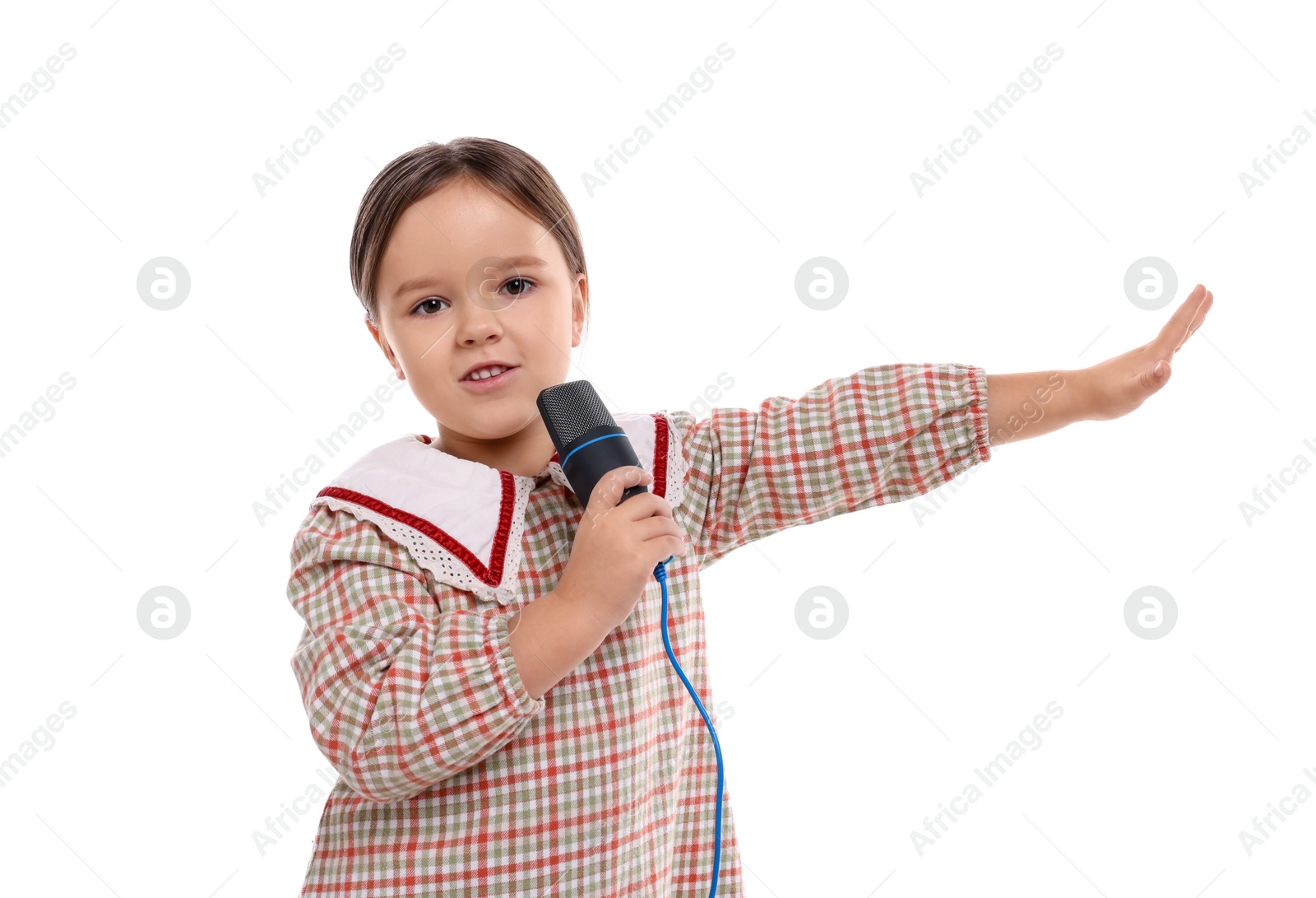 Photo of Cute girl with microphone singing on white background