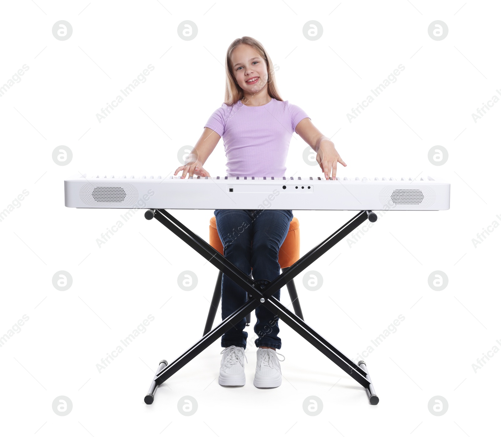 Photo of Cute girl playing synthesizer on white background