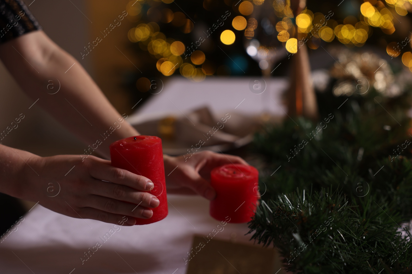 Photo of Woman setting table for dinner at home, closeup