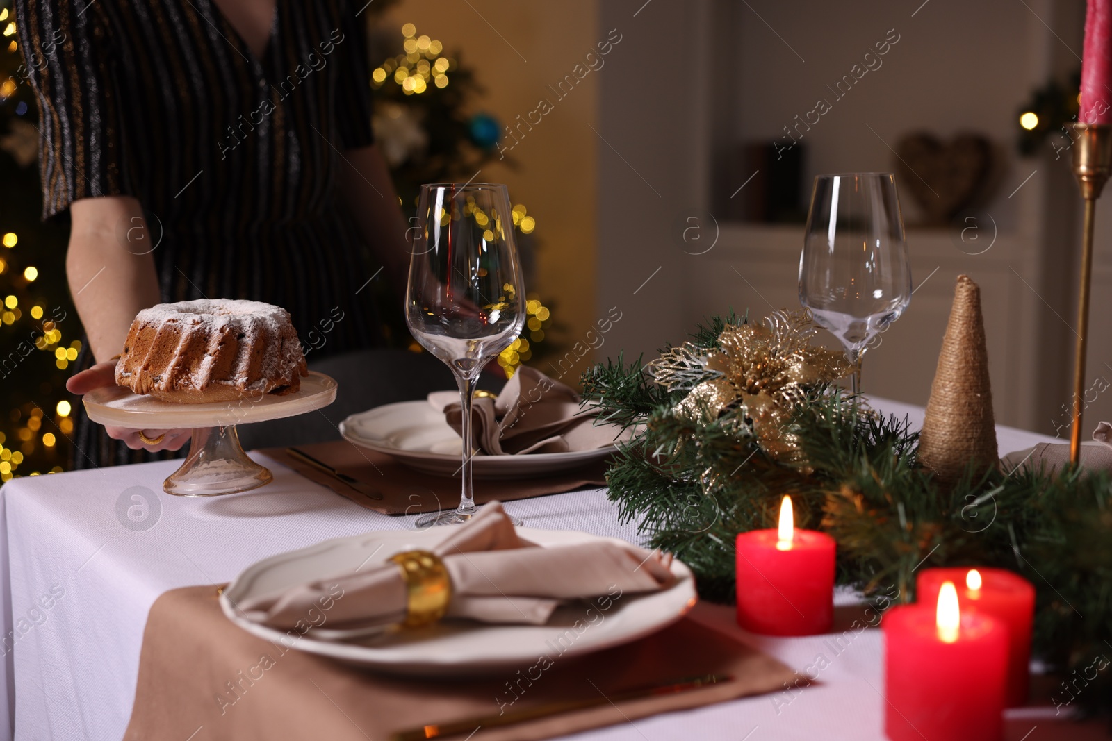 Photo of Woman setting table for dinner at home, closeup