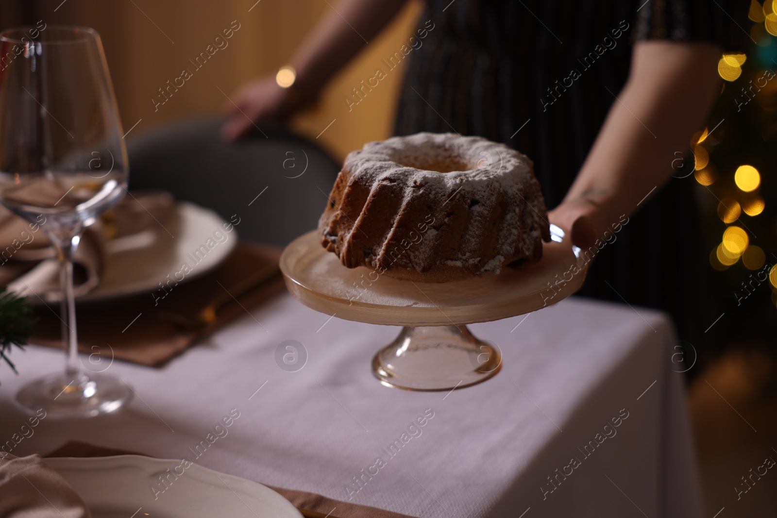 Photo of Woman setting table for dinner at home, closeup