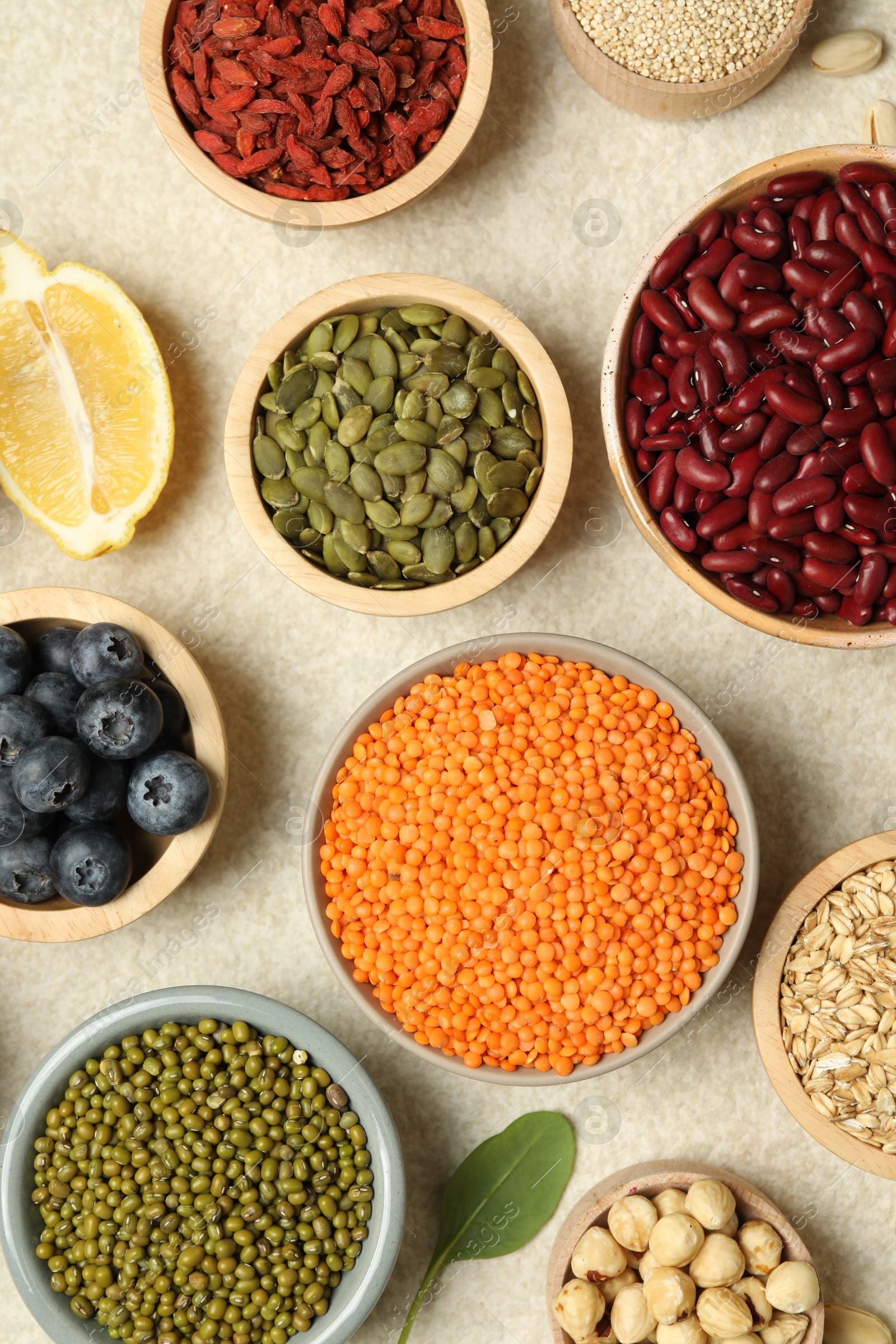 Photo of Different superfood products on light table, flat lay