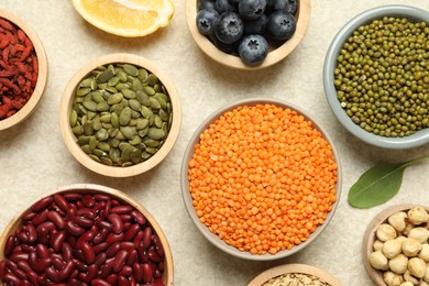 Photo of Different superfood products on light table, flat lay