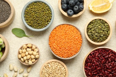 Photo of Different superfood products on light table, flat lay