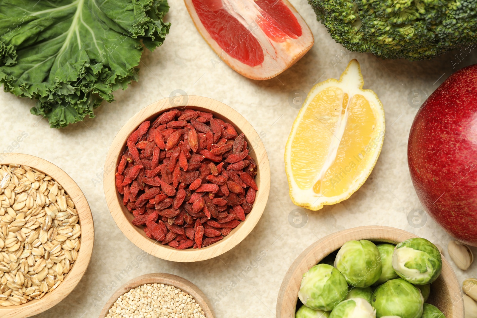 Photo of Different superfood products on light table, flat lay