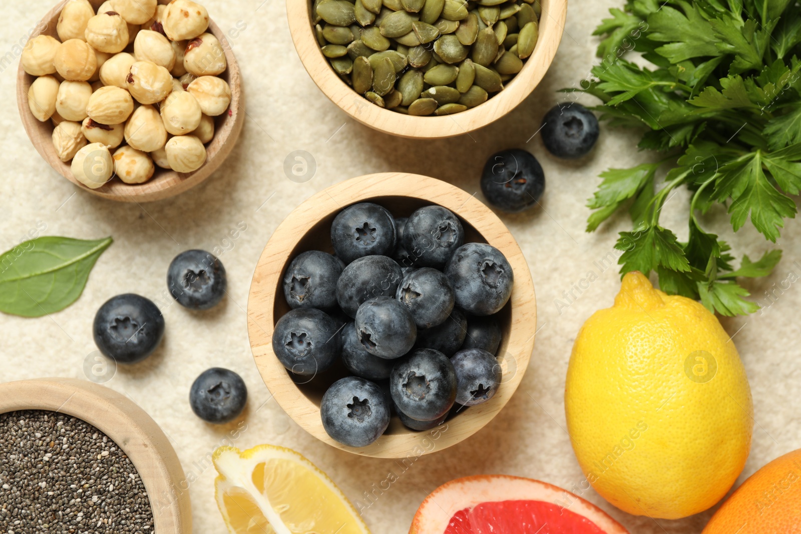 Photo of Different superfood products on light table, flat lay