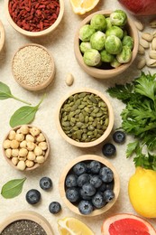 Photo of Different superfood products on light table, flat lay