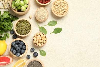 Photo of Different superfood products on light table, flat lay. Space for text