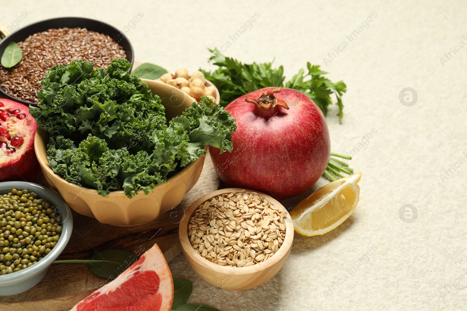 Photo of Different superfood products on light table, closeup