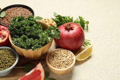 Photo of Different superfood products on light table, closeup