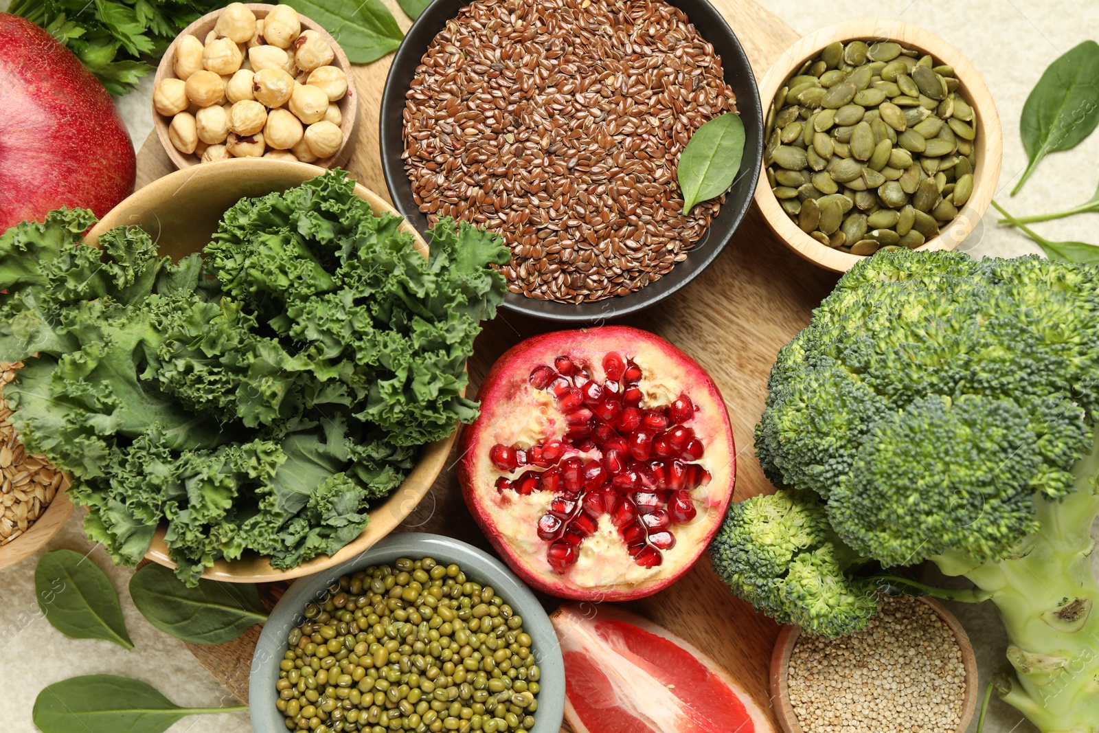 Photo of Different superfood products on light table, closeup