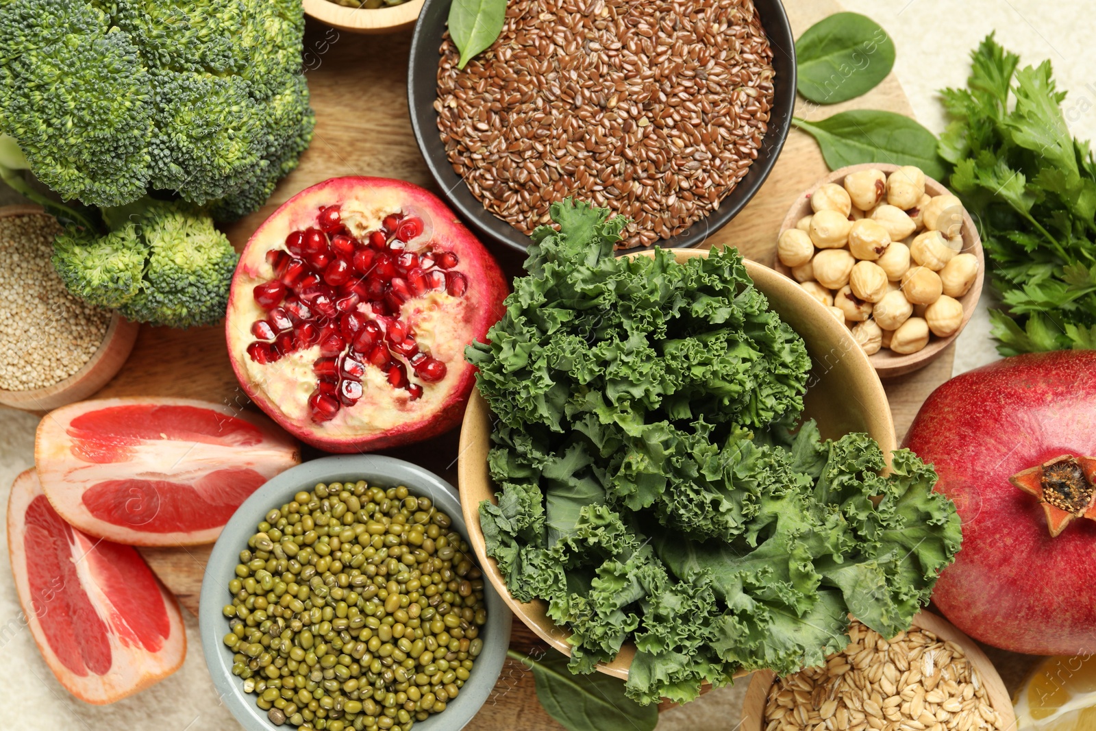 Photo of Different superfood products on light table, closeup