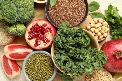 Photo of Different superfood products on light table, closeup