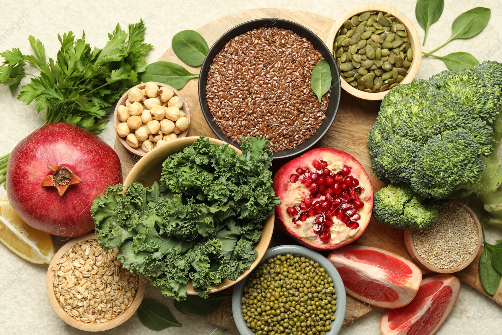 Photo of Different superfood products on light table, closeup