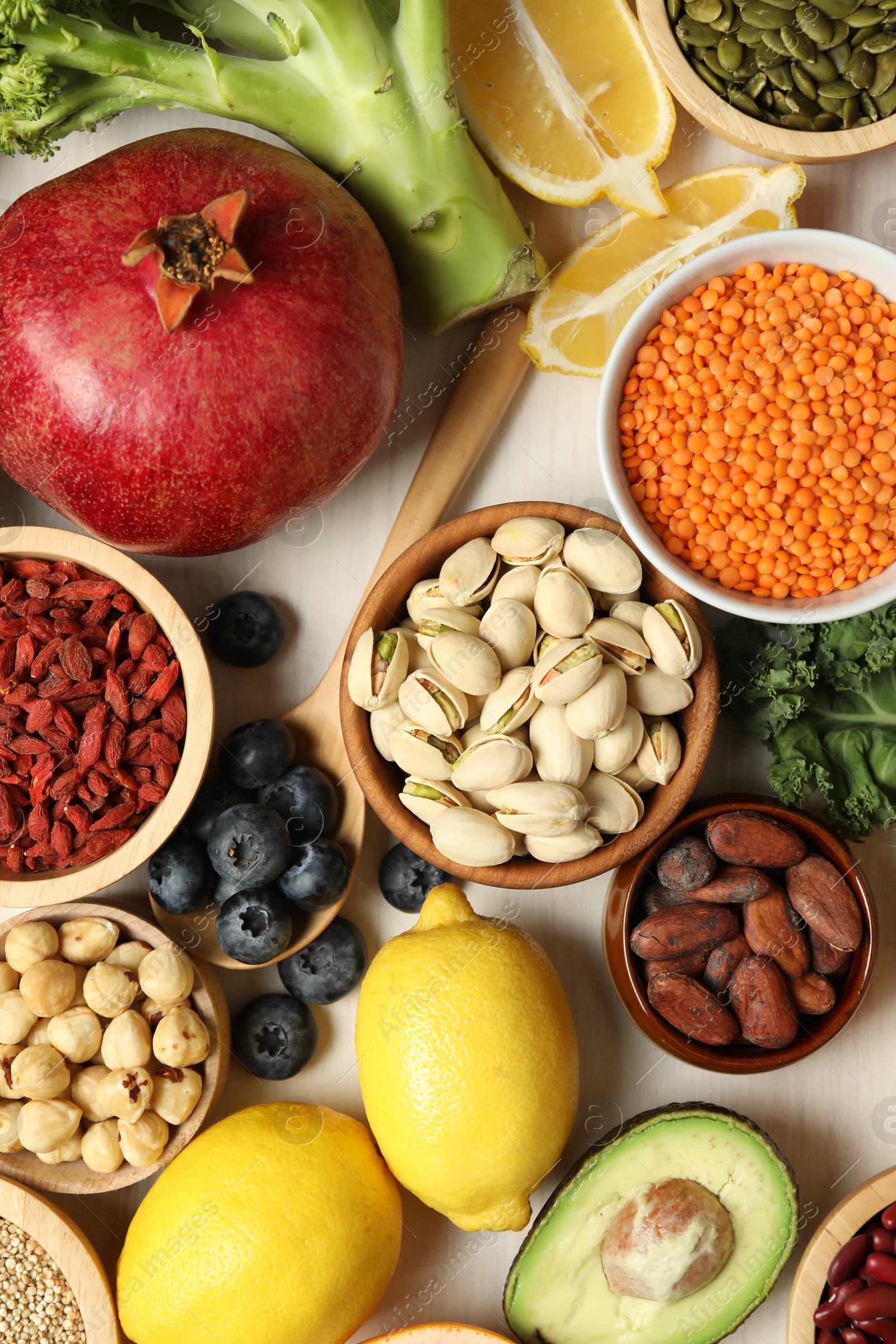 Photo of Different superfood products on white table, flat lay