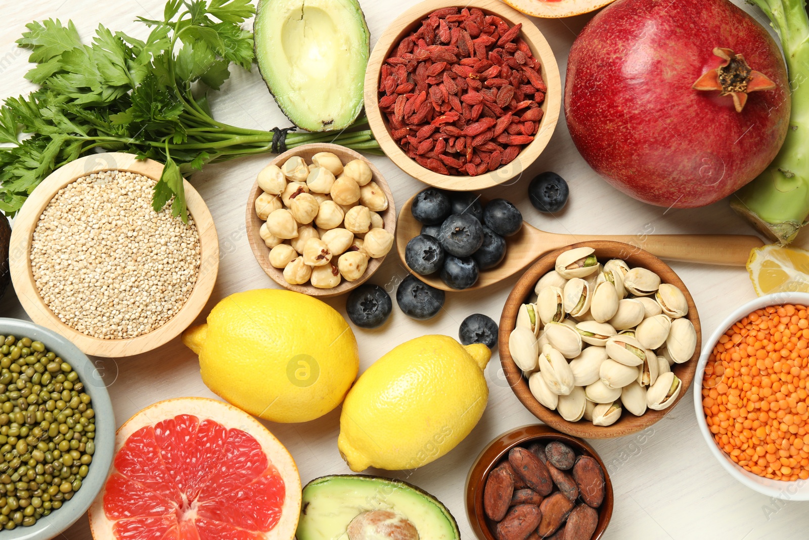 Photo of Different superfood products on white table, flat lay