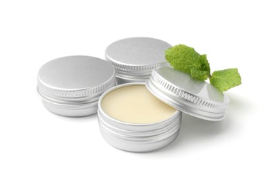 Photo of Mint lip balms and green leaves isolated on white. Cosmetic product