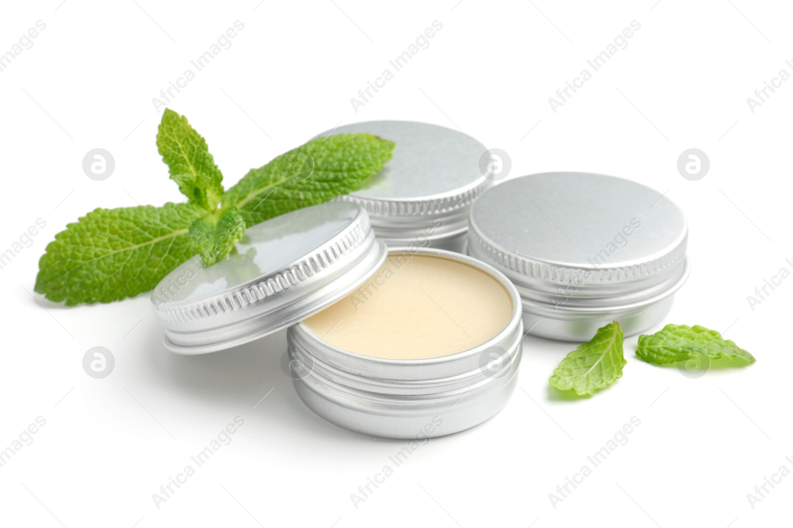 Photo of Mint lip balms and green leaves isolated on white. Cosmetic product