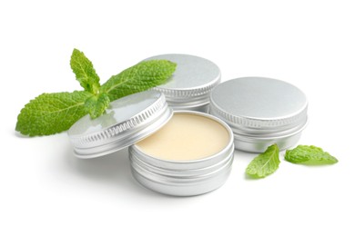 Photo of Mint lip balms and green leaves isolated on white. Cosmetic product