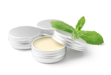 Photo of Mint lip balms and green leaves isolated on white. Cosmetic product